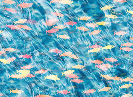 shoal of fish on a blue waterの写真素材