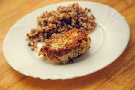 economy food. rissole and buckwheat groats. warm tonedの写真素材