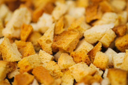 many small pieces of dried bread. selective focus technique. Blur backgroundsの写真素材