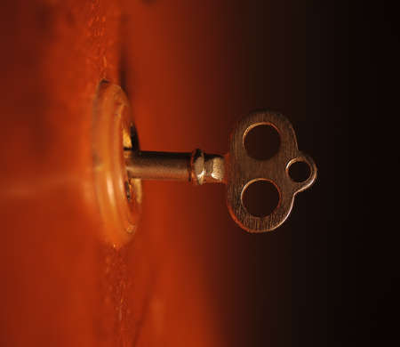 golden old secret key photo. Natural warm light from yellow lampの写真素材