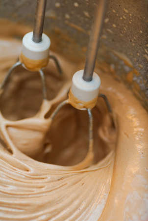 knead sweet cream of mixer whisk. Motion blur effect because fast rotation elementの写真素材