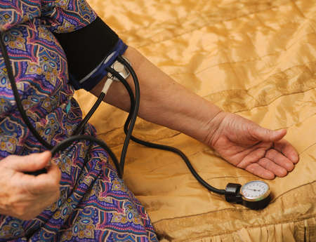 old woman to pressure measurementの写真素材