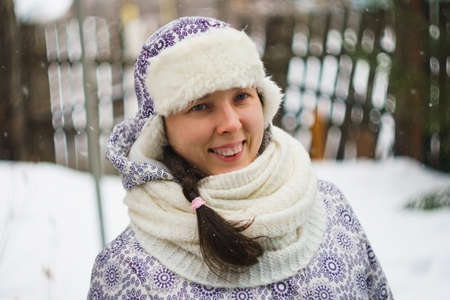 face of happy woman in the winter. classic portrait soft focus and bokeh photographed on manual lensの写真素材