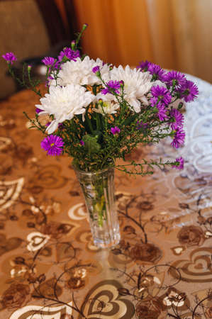 indoor vase with aster and white chrysanthemumの写真素材