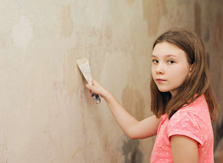 girl with a spatula putty wallの写真素材
