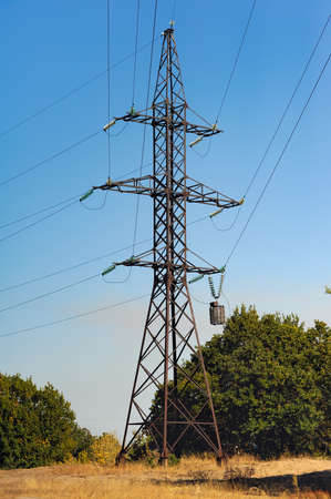 electricity tower in autumn forest. environmental problemの写真素材