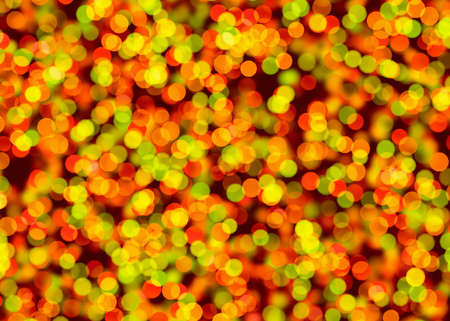 blurry festive background consisting of bright colored circles. multicolored bokehの写真素材