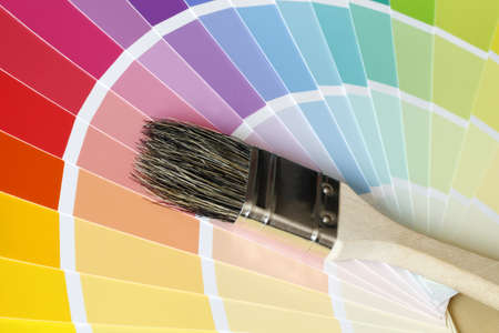 a brush lies on color tables