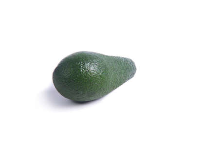 Dark green avocado fruit on white background with shadow