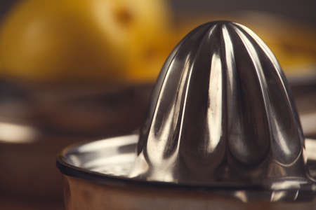 Fine art still life with orange juice and porcelain juicer on wooden table
