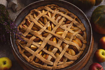 Preparation, Thanksgiving Day celebration. Baked apple pie on a baking sheet. Close-up. Making traditional apple pie.の写真素材