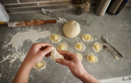 Cooking in the kitchen of beautiful dumplings with potatoes. Close up