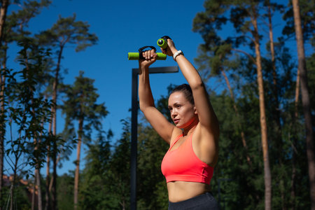 Healthy lifestyle of a young sporty woman. Concept of outdoor training