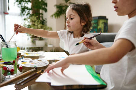 Adorable children, draw at home. Art lesson at home, Easter theme, watercolor technique. Art educationの写真素材