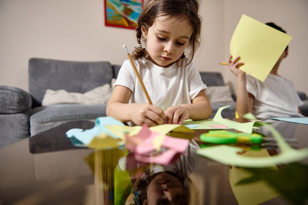 Caucasian little preschool girl drawing at home. Children creativityの写真素材