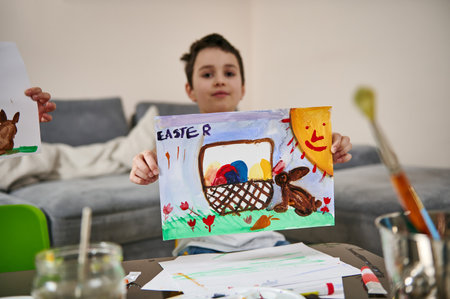 A happy schoolboy showing his beautiful drawing to the camera, Easter theme, watercolor technique....