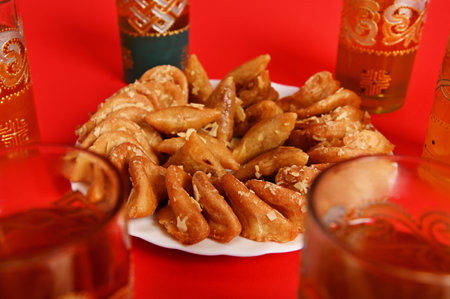 Soft focus on tasty and sweet plate full of fresh traditional Moroccan handmade Brewat sweets. Red...