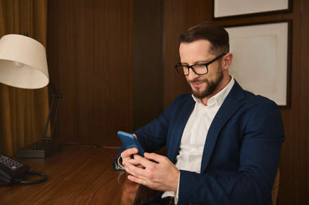 Handsome attractive prosperous successful businessman, business traveler, investor wearing...