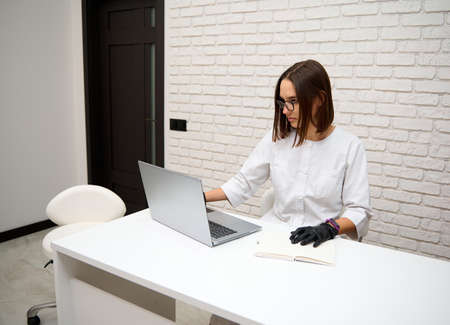 Caucasian young beautiful professional general practitioner woman, female doctor working in medical...