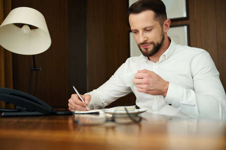 Attractive handsome successful self-confident Caucasian entrepreneur, journalist, businessman at...