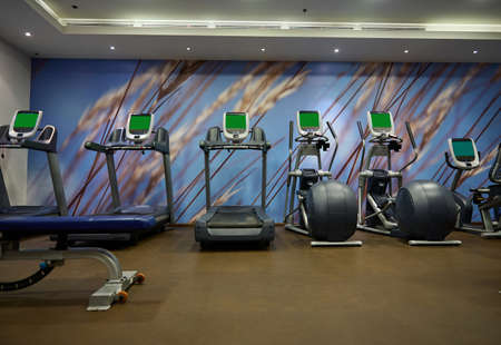 Modern gym interior with equipment. Fitness center interior