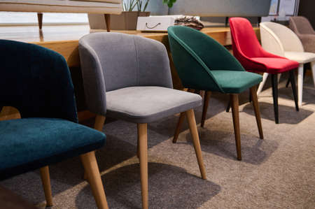 Chairs in salon of furniture. Showroom, exhibition hall of modern soft furniture, upholstered furnitureの写真素材