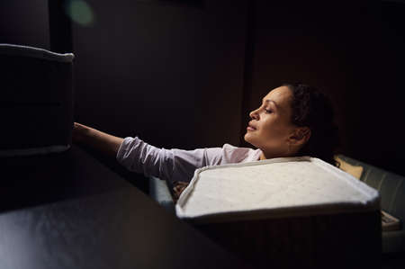 Close-up portrait of a multitasking woman sales manager, interior designer arranging samples of...