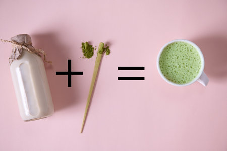 Flat lay. Recipe for antioxidant healthy oriental refreshing drink. A bottle of organic plant-based milk plus scoop of powdered green tea equal matcha latte, over pink background. Japanese traditionsの写真素材