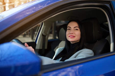 Close up portrait of Caucasian confident 40-44 year old beautiful business woman, driver putting...