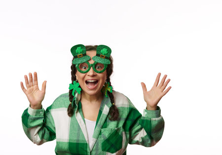 Cheerful woman smiling, looking at camera through stylish carnival eyeglasses in the shape of...