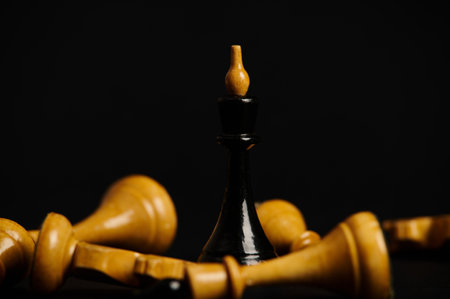 Destruction of chess figures series. Kings facing each other. Symbolic illustration of total war, disagreement, disaster and failure. Isolated over black background. Selective focus. Still lifeの写真素材