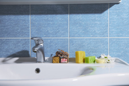 Still life with cold pressed organic ecologically friendly soap bars with natural ingredients on the bathroom washbasin. Natural eco-friendly cosmetics, home spa, body care, hygiene and beauty conceptの写真素材