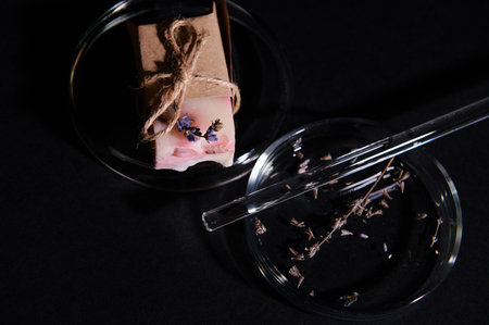 Details on a bar of soap with natural organic ecologically-friendly ingredients, wrapped in eco...