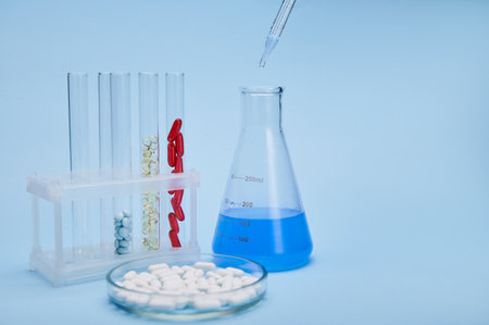 Still life with labware and medicines. Petri dish with white medical pills, test tubes with gel...