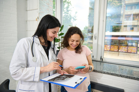 Happy and carefree pregnancy. Obstetrics and gynecology. Pregnant woman at obstetrician gynecologist...