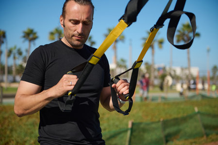 Close-up portrait of confident determined muscular build young adult man, sportsman, athlete...