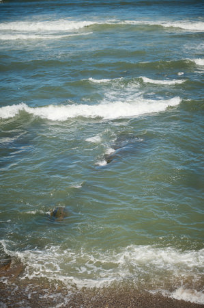 View from above of sea waves pounding on the headland. Atlantic ocean background. Nature backgroundの写真素材