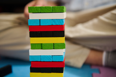 A vibrant stack of colorful wooden blocks, perfect for engaging children's play and education. This image captures the essence of fun and creativity, encouraging imaginative and learning experiences.の写真素材