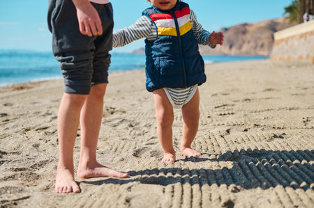 Children enjoying a sunny day on a sandy coastline, embracing barefoot moments under warm skies -...