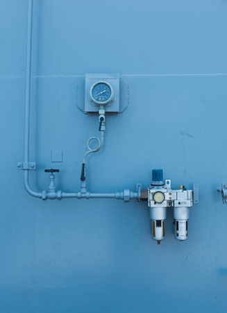 Steel pipe flanges line and meter from cylinder tank for industrial use, In safety zone.の写真素材