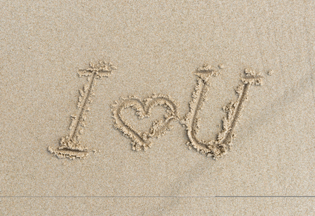 I LOVE YOU .Sand beach background with writing I love you on sand.beach nature background.の写真素材