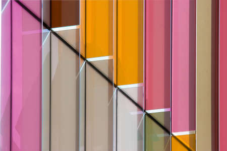 Brightly coloured plastic vanes on the side of a building in Oxfordの写真素材