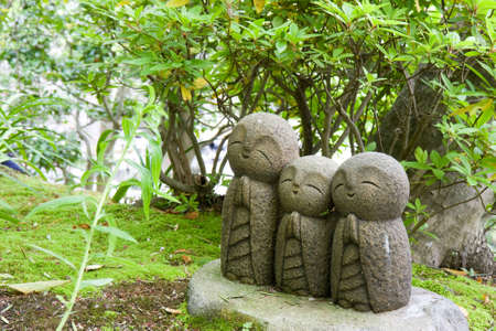 Three statues at a temple in Kyotoの写真素材