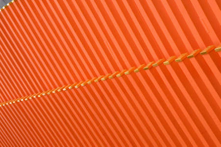 Repeating orange sections of a roof of a Japanese templeの写真素材