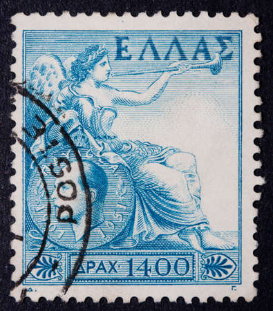 Greece - Circa 1970: A postmarked stamp showing a reclining woman with a trumpetの写真素材