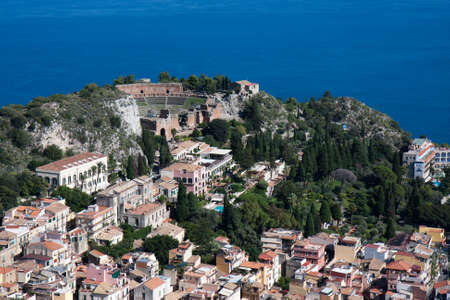 Looking down at the historic town of Taormina in Sicilyの写真素材