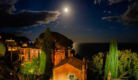 Taormina cloudy mediterranean moonlight. Ionian sea, Sicily, Italyの写真素材