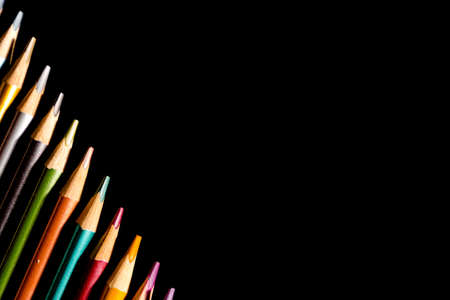 Set beautiful black, colored pencils of colored pencils on black background. Soon to school. Back to Schoolの写真素材