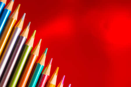 Set beautiful bronze , colored pencils of colored pencils on bronze background. Soon to school. Back to Schoolの写真素材