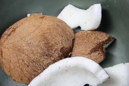 photo of coconut contents with white contents and brown skin